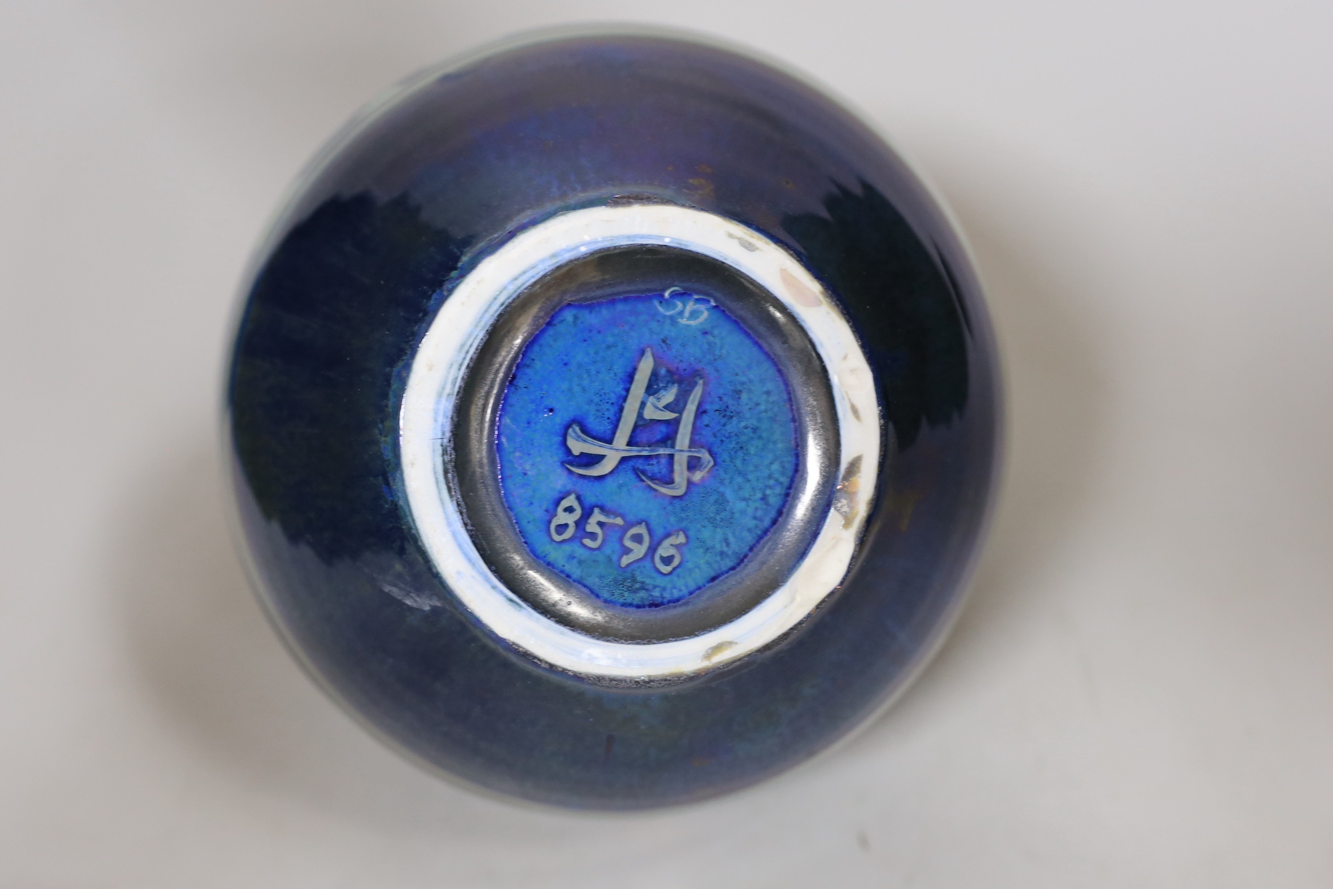 A Chiswell Jones art pottery lustre vase, decorated with three fish, No 8596, 21cm